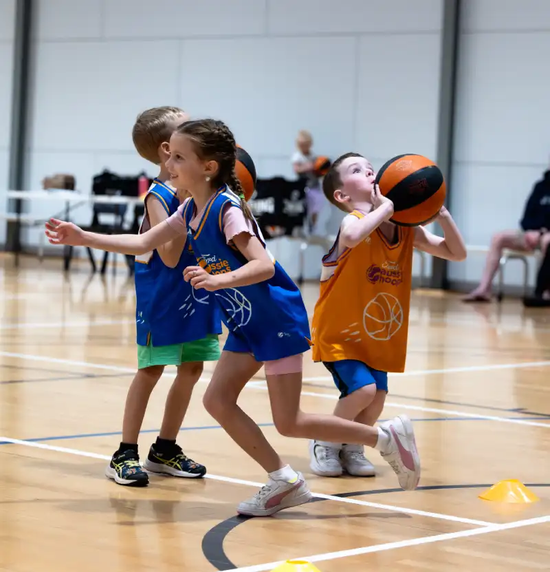 Kids playing Aussie Hoops basketball